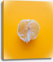 Постер Очищенный апельсин на желтом фоне