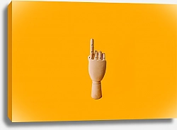 Постер Деревянная рука на желтом фоне