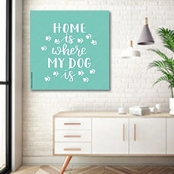 «Иллюстрация с фразой «Дом там, где находится ваша собака»» в интерьере комнаты в скандинавском стиле над тумбой