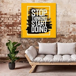 «Мотивирующий плакат» в интерьере гостиной в стиле лофт над диваном
