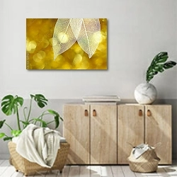 «Белые прозрачные листья на золотом фоне» в интерьере современной комнаты над комодом