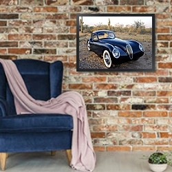 «Jaguar XK120M Fixed Head Coupe '1953» в интерьере в стиле лофт с кирпичной стеной и синим креслом