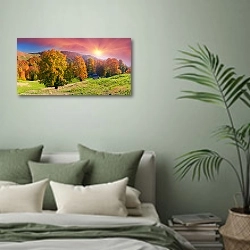 «Осенний пейзаж с закатным солнцем» в интерьере современной спальни в зеленых тонах