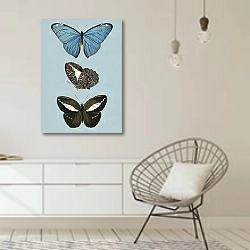«Винтажная иллюстрация с бабочками на  голубом фоне» в интерьере белой комнаты в скандинавском стиле над комодом