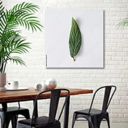 «Зеленый сочный листок на сером фоне» в интерьере столовой в скандинавском стиле с кирпичной стеной